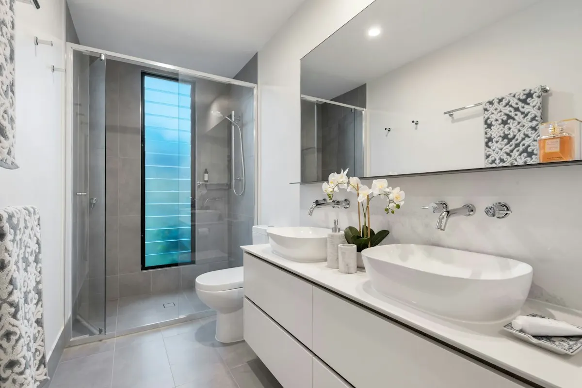 Bathroom vanity with a vessel basin and mirror