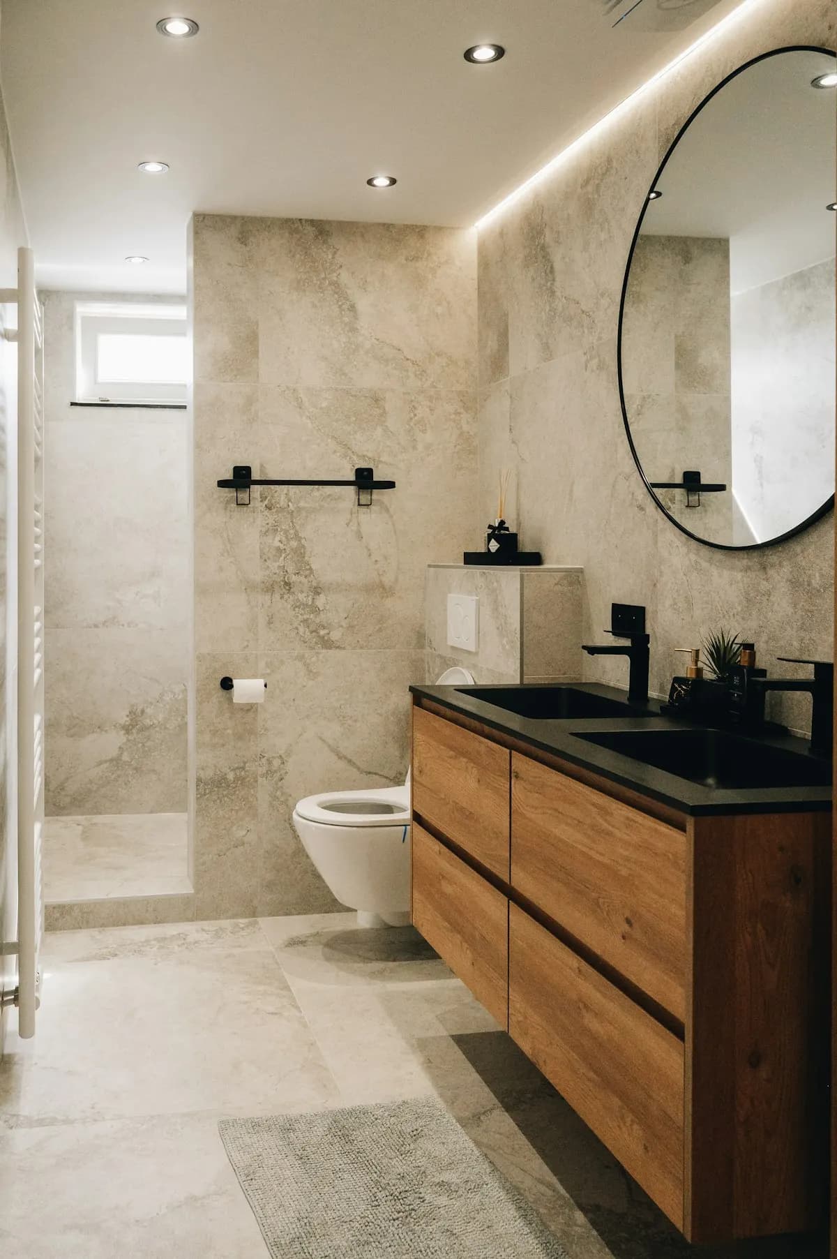 Bathroom with a timber vanity and glass shower screen